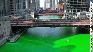 The city surprised residents by dying the river green after initially canceling the St. Patrick's Day tradition because of Covid-19.