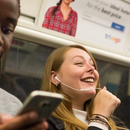 TfL Image Commuters using their phones in a tunnel on the jubilee line e1657273402722